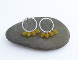 hoop earrings with yellow gemstone