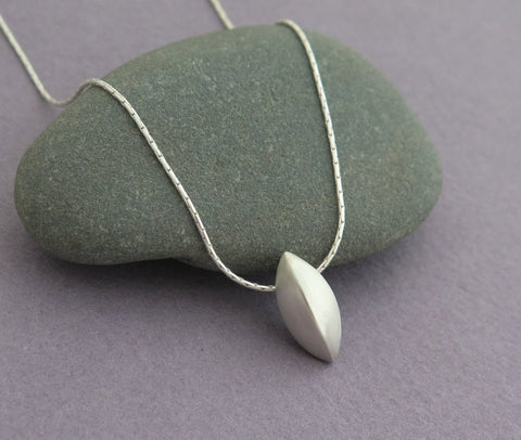 seed pod pendant necklace