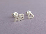 letters and heart earrings